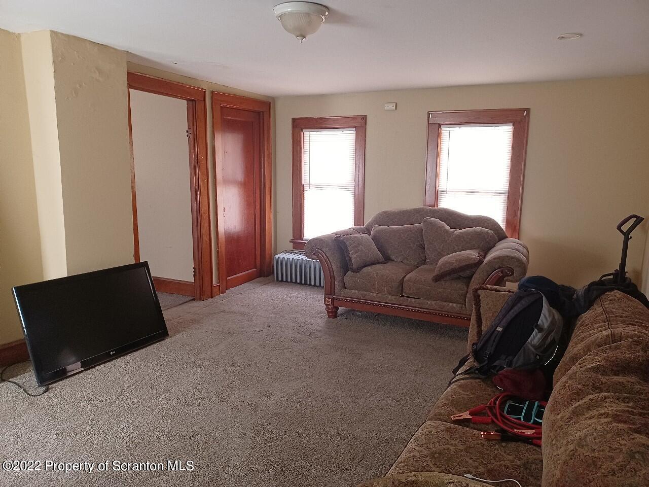 415 Maple Street Scranton, PA 18505 - Photo 11 of 22 a living room with furniture and a window