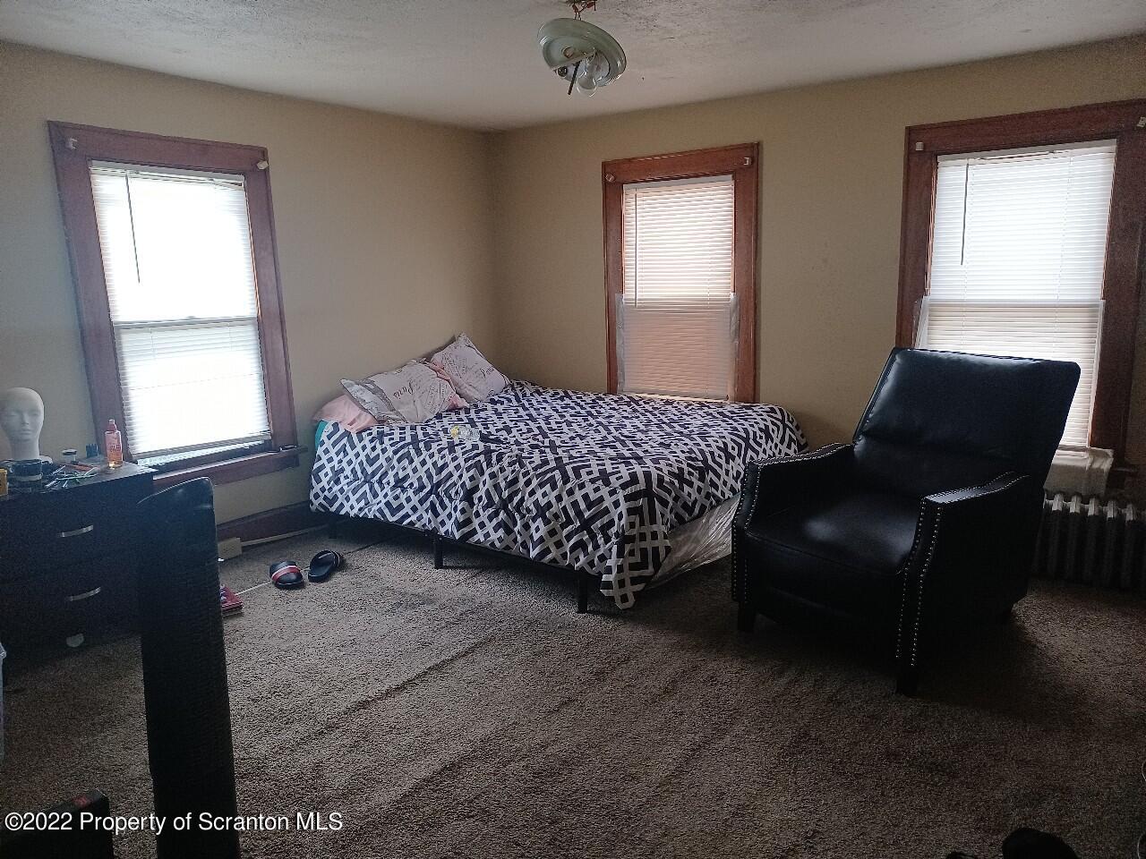 415 Maple Street Scranton, PA 18505 - Photo 13 of 22 a bedroom with a bed and window