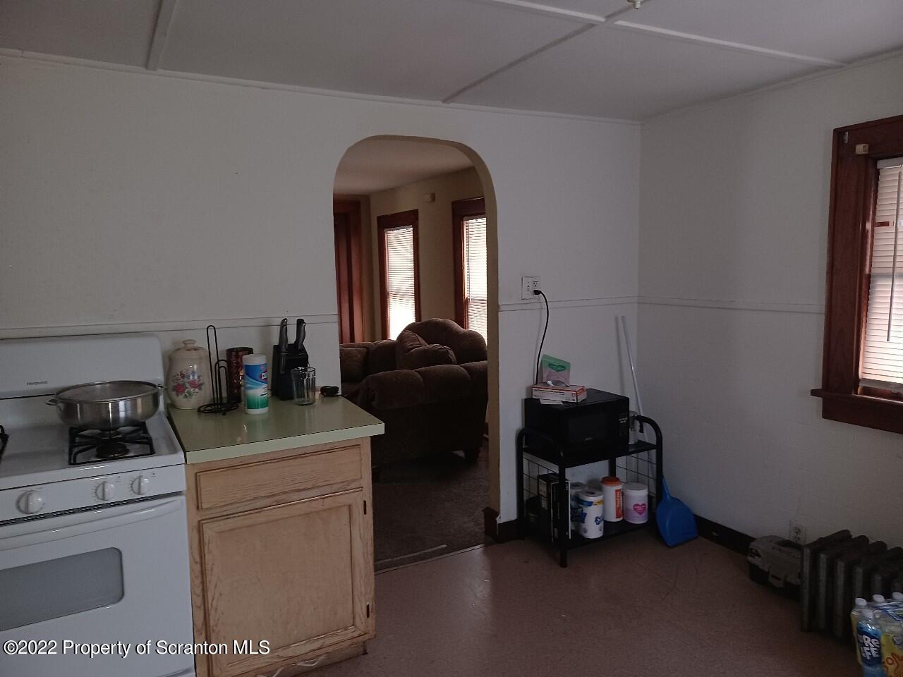415 Maple Street Scranton, PA 18505 - Photo 16 of 22 a bedroom with a bed and a cabinet
