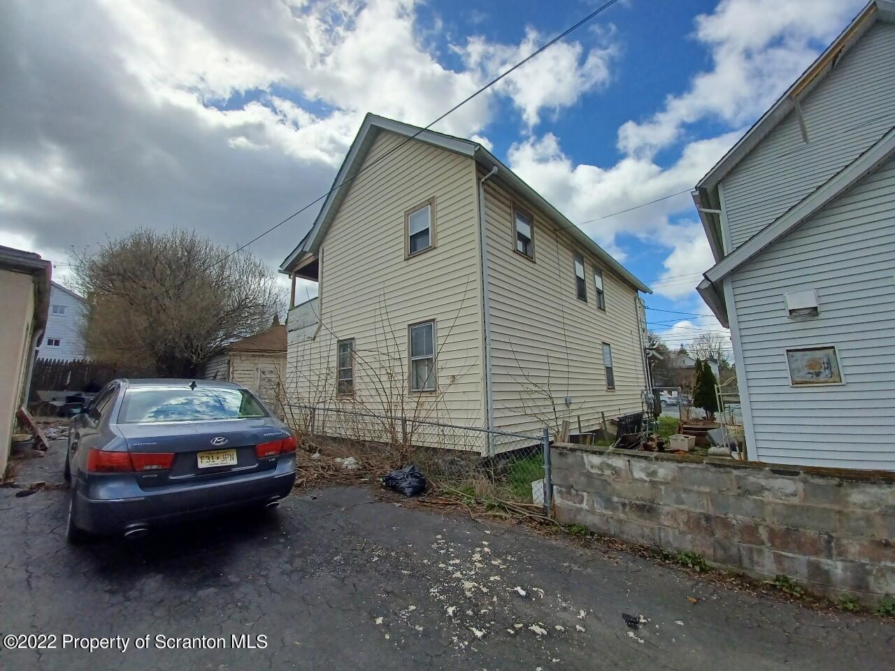 415 Maple Street Scranton, PA 18505 - Photo 2 of 22 a car parked in front of a house