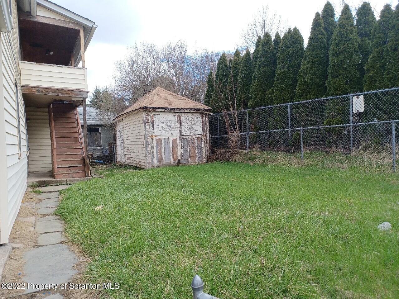 415 Maple Street Scranton, PA 18505 - Photo 3 of 22 a view of a house with a yard and sitting area