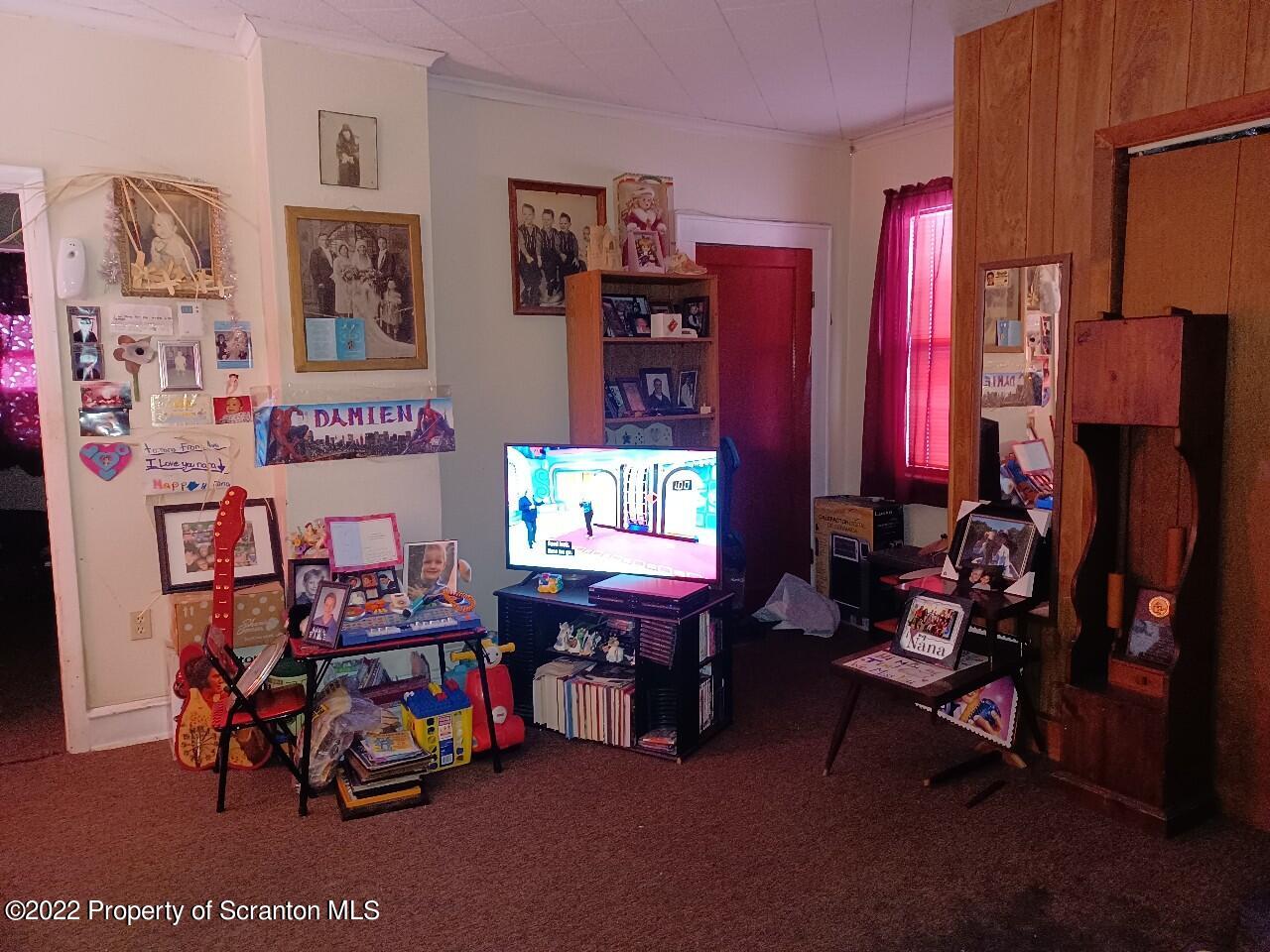 415 Maple Street Scranton, PA 18505 - Photo 6 of 22 a living room with lots of furniture and a flat screen tv