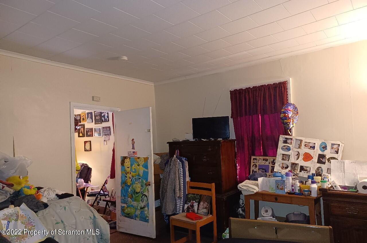 415 Maple Street Scranton, PA 18505 - Photo 8 of 22 a living room with furniture and a flat screen tv