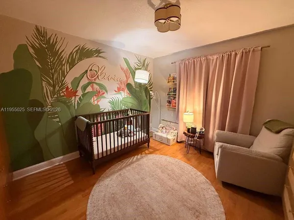 a view of a livingroom with furniture and staircase