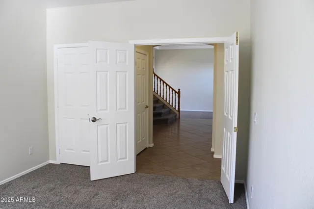 a view of a hallway with closet area