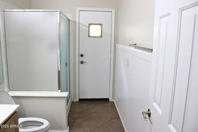 a bathroom with a sink and toilet