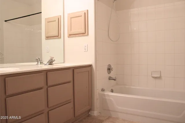 a bathroom with a bathtub and a sink