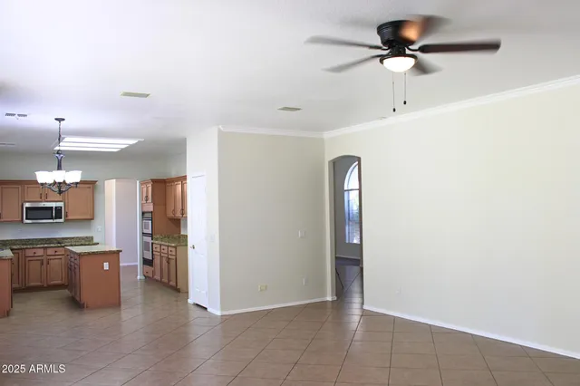 a view of a kitchen with a sink and cabinets