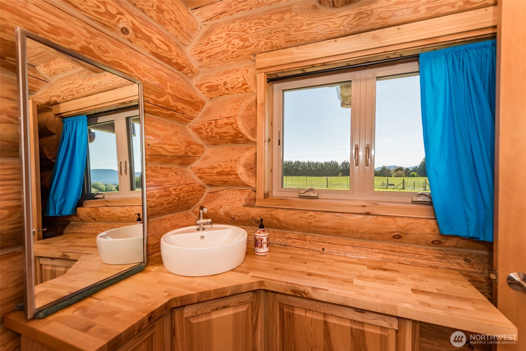 71 Shepherds Way Sequim, WA 98382 - Photo 34 of 39 a bathroom with a sink a bathtub and next to a window
