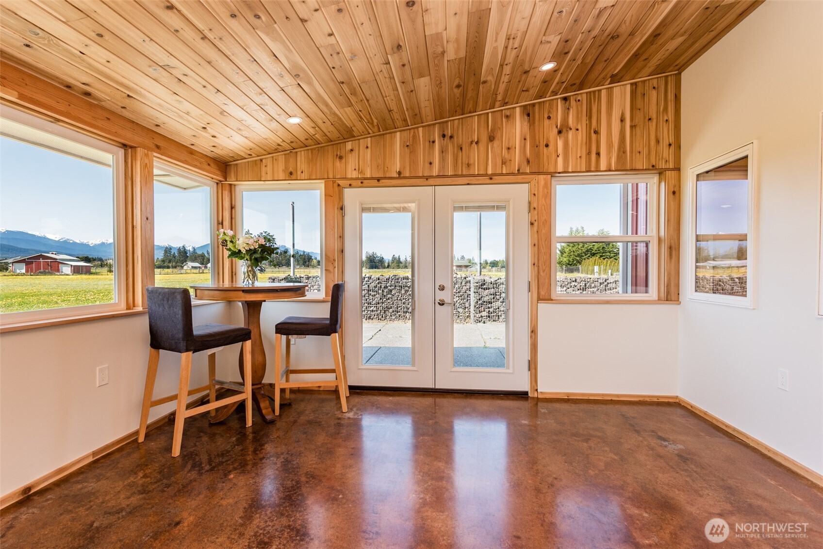 71 Shepherds Way Sequim, WA 98382 - Photo 6 of 39 a dining room with wooden floor and furniture