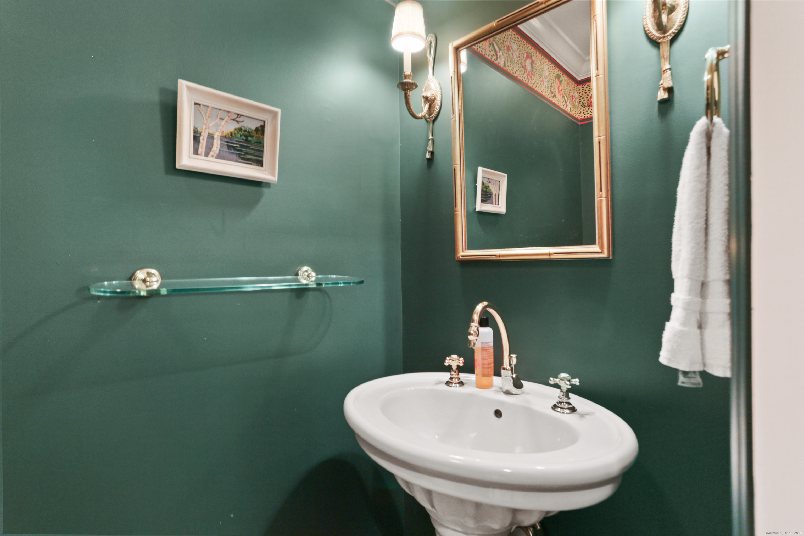 47 Bank Street, Unit 47 New Canaan, CT 06840 - Photo 11 of 40 a bathroom with a sink and mirror