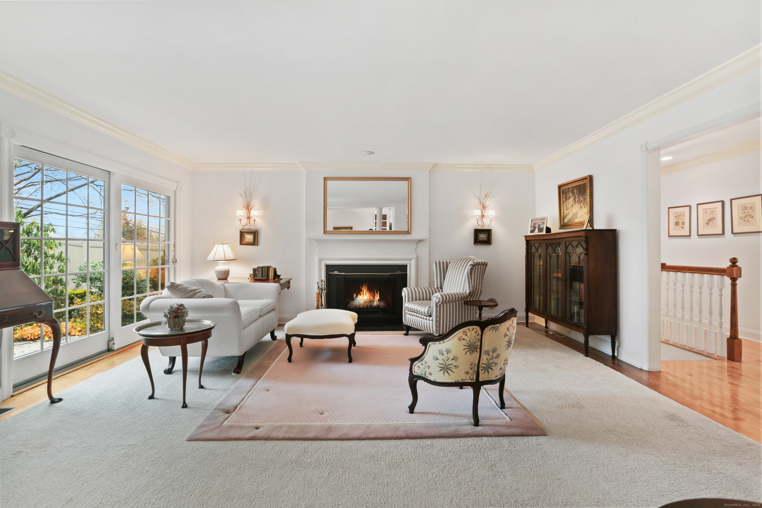 47 Bank Street, Unit 47 New Canaan, CT 06840 - Photo 23 of 40 a living room with furniture and a fireplace