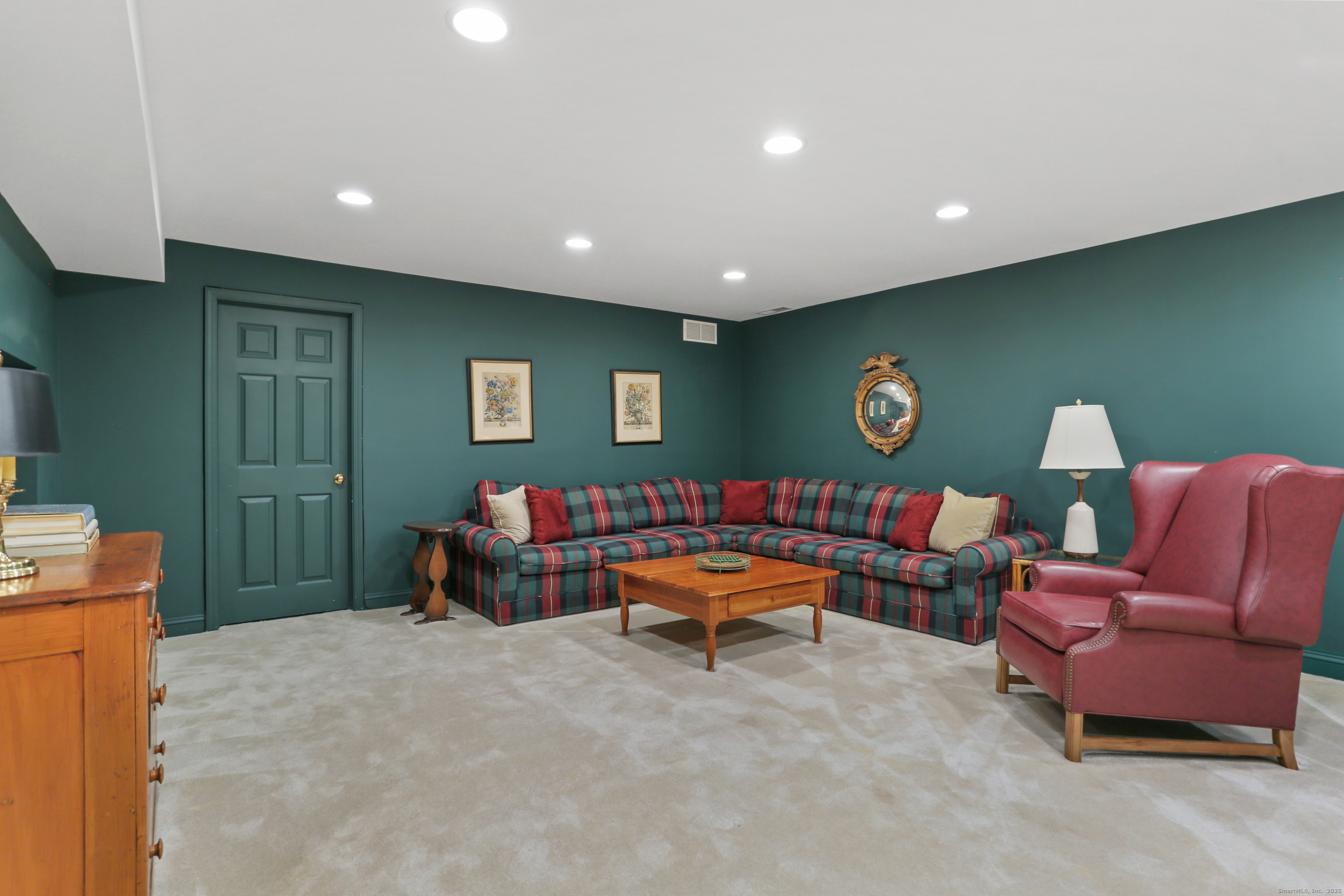 47 Bank Street, Unit 47 New Canaan, CT 06840 - Photo 35 of 40 a mini theater with a projector and furniture