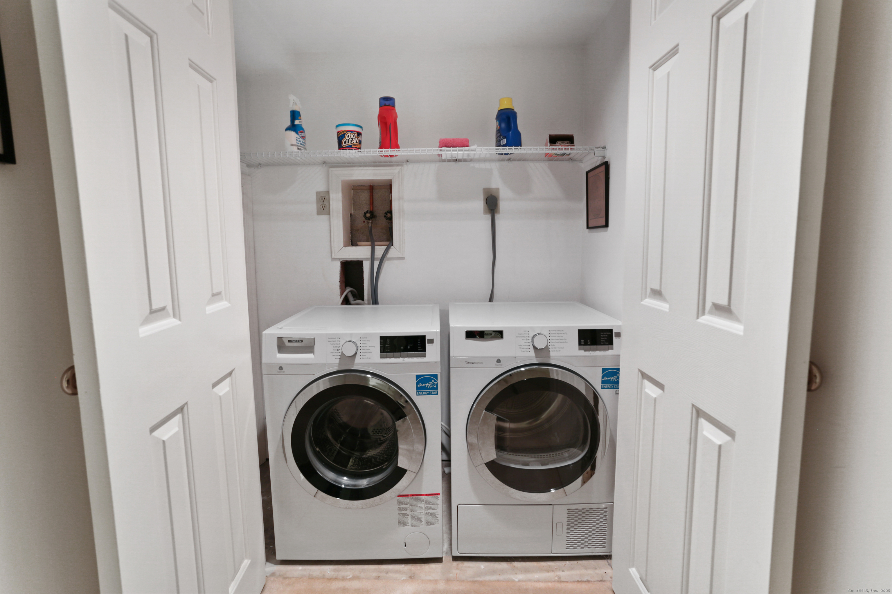 47 Bank Street, Unit 47 New Canaan, CT 06840 - Photo 37 of 40 a utility room with dryer and washer