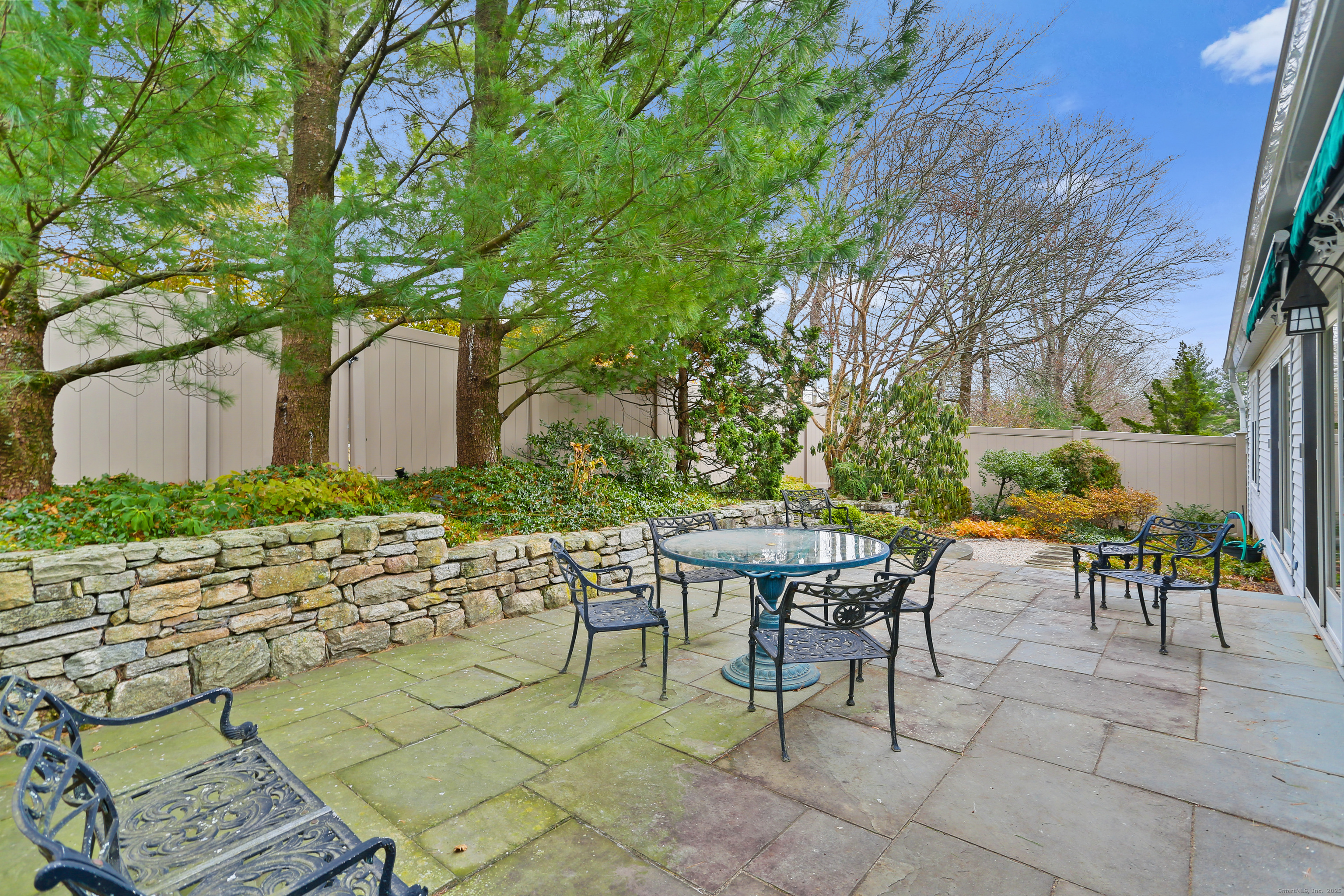 47 Bank Street, Unit 47 New Canaan, CT 06840 - Photo 38 of 40 a view of an outdoor space with a patio