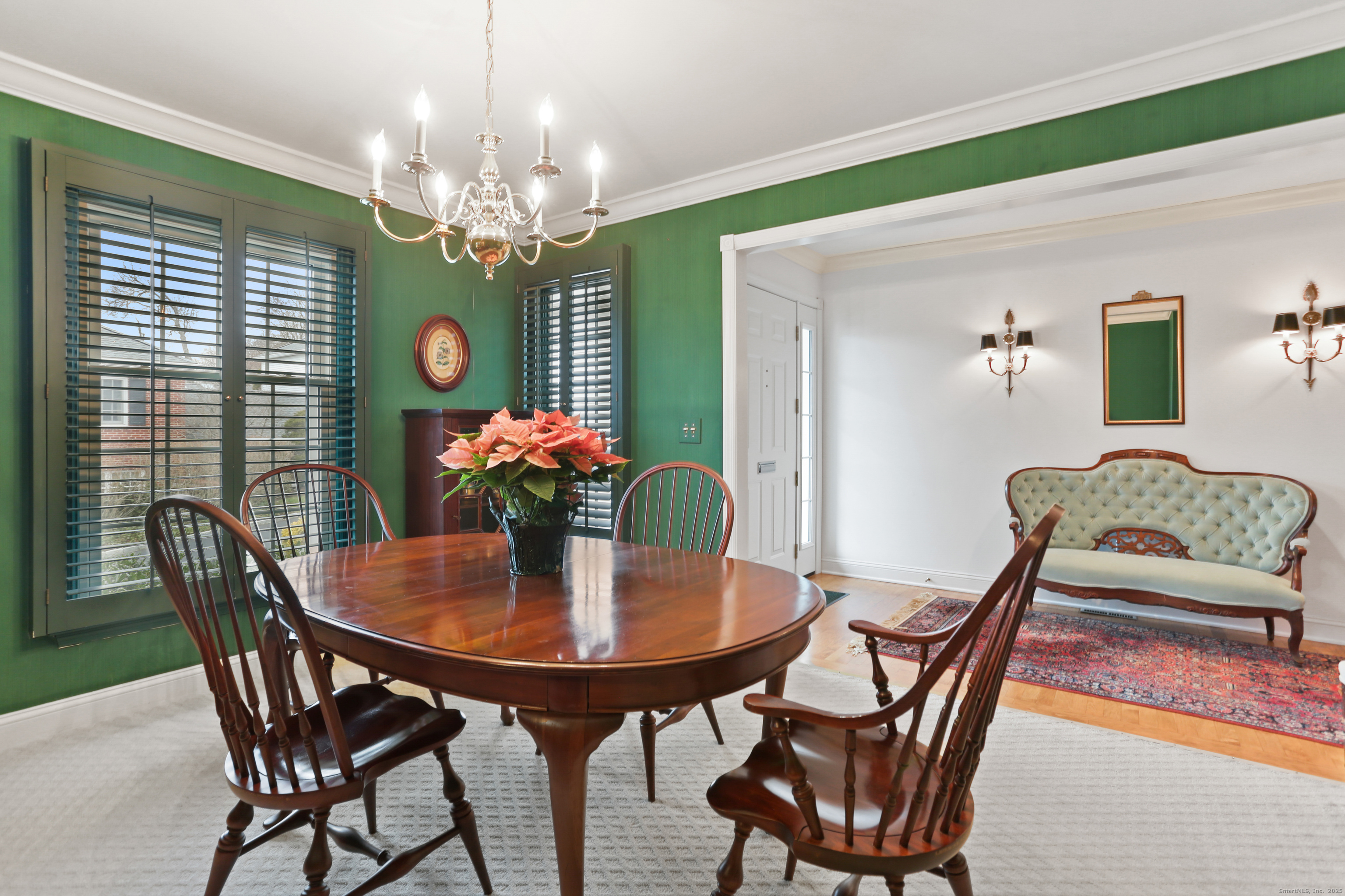 47 Bank Street, Unit 47 New Canaan, CT 06840 - Photo 9 of 40 a dining room with furniture and a chandelier