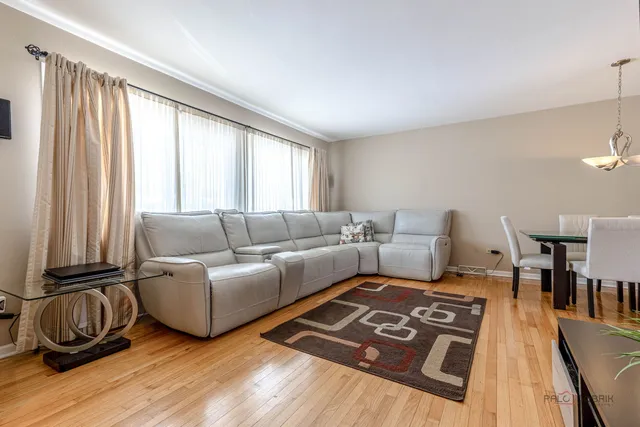 a living room with furniture and a rug