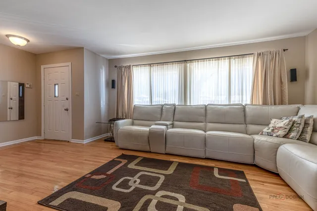 a living room with furniture and a rug
