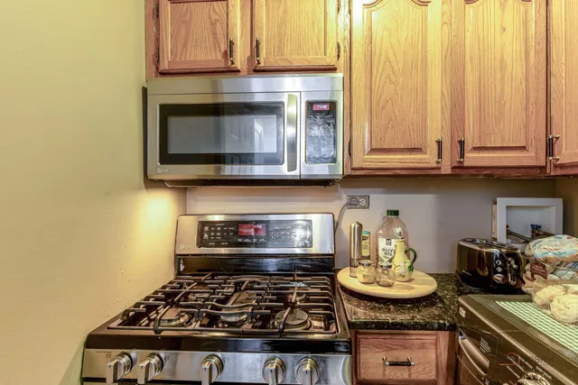 a kitchen with a stove and a microwave
