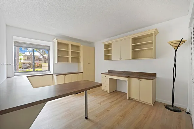 a living room filled with furniture hardwood floor and a window