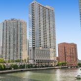 a view of a large building with a water view