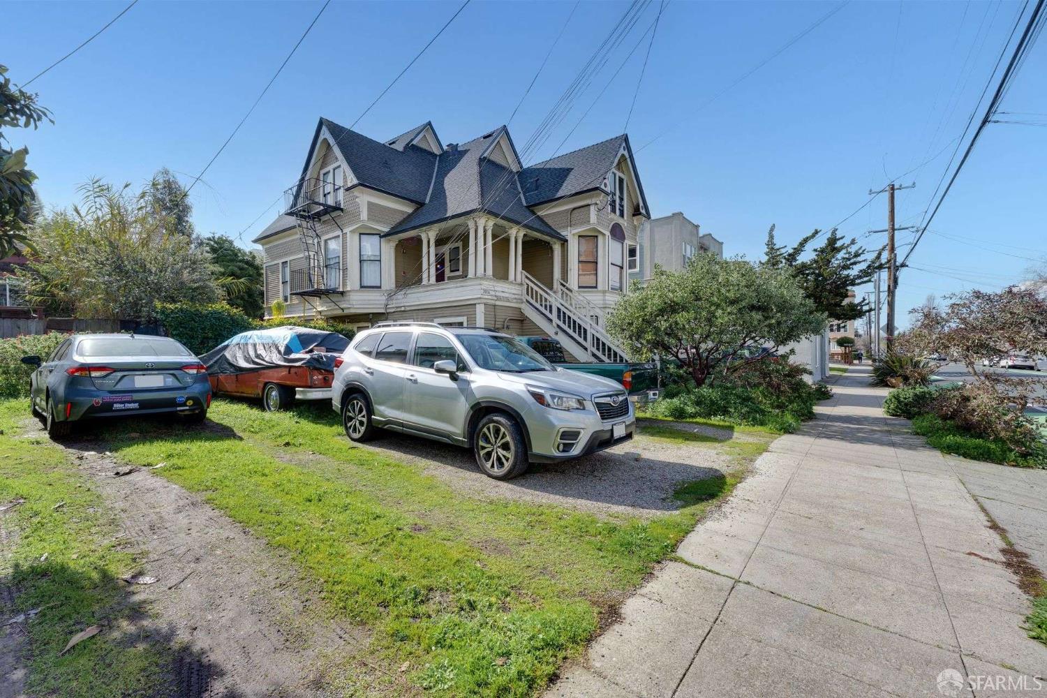 2014 Channing Way Berkeley, CA 94704 - Photo 2 of 20 a front view of a house with a garden and parking space