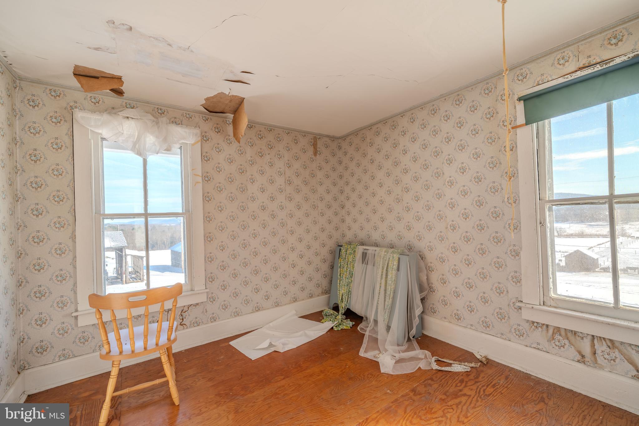 7606 Rose Valley Road Trout Run, PA 17771 - Photo 30 of 52 a view of a room with gym equipment and windows