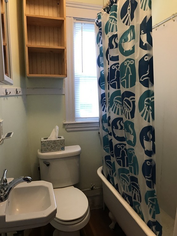 27 Floyd Street Revere, MA 02151 - Photo 12 of 21 a bathroom with a toilet a sink and a window