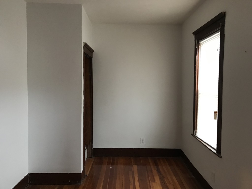 27 Floyd Street Revere, MA 02151 - Photo 13 of 21 an empty room with wooden floor and windows