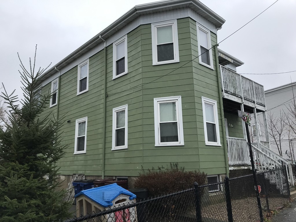 27 Floyd Street Revere, MA 02151 - Photo 2 of 21 a backyard of a house with seating space