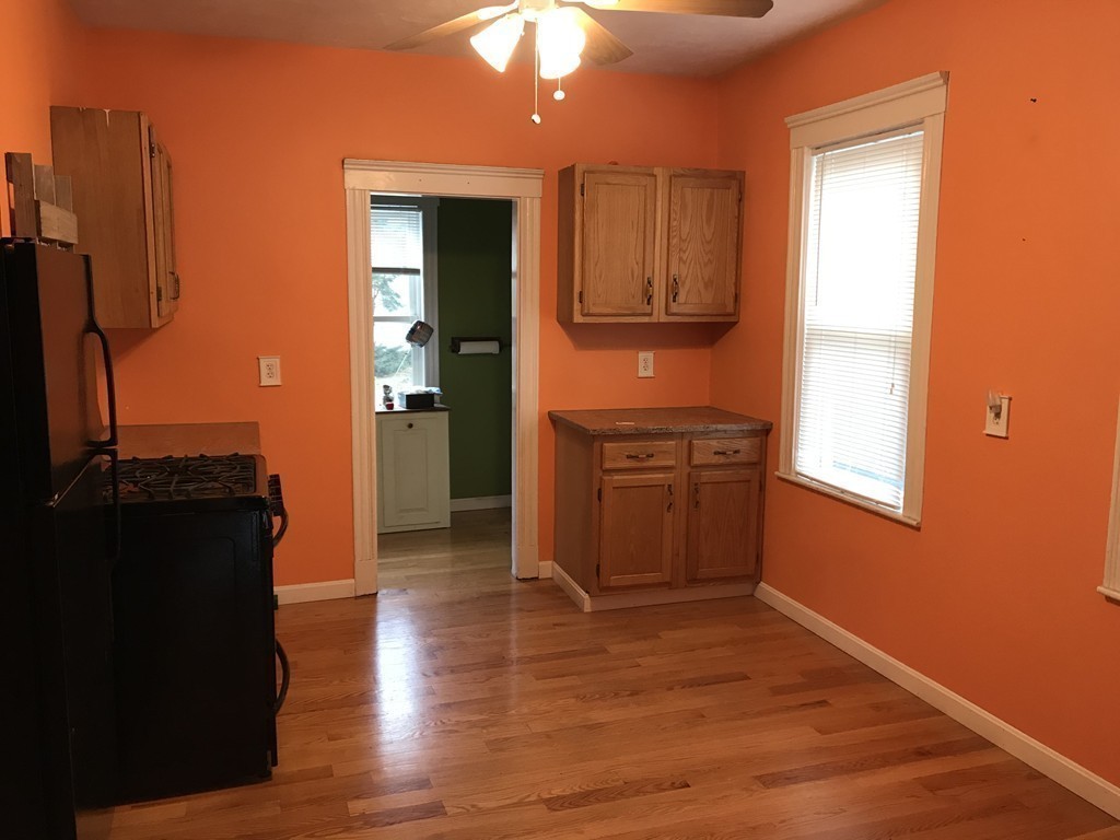 27 Floyd Street Revere, MA 02151 - Photo 8 of 21 a view of a kitchen from the hallway