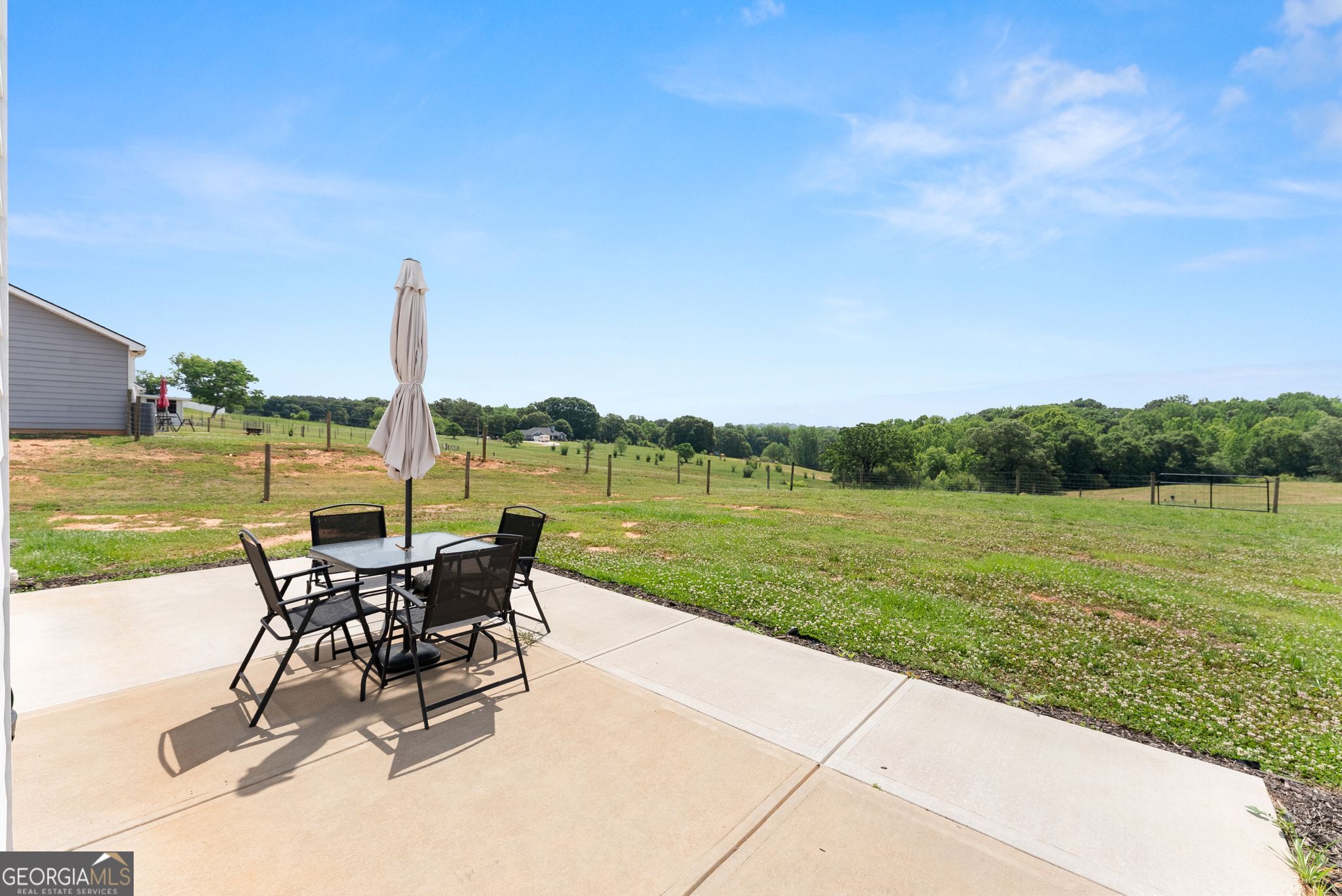 810 Anderson Thomas Road Martin, GA 30557 - Photo 29 of 40 a view of a lake with table and chairs next to an ocean