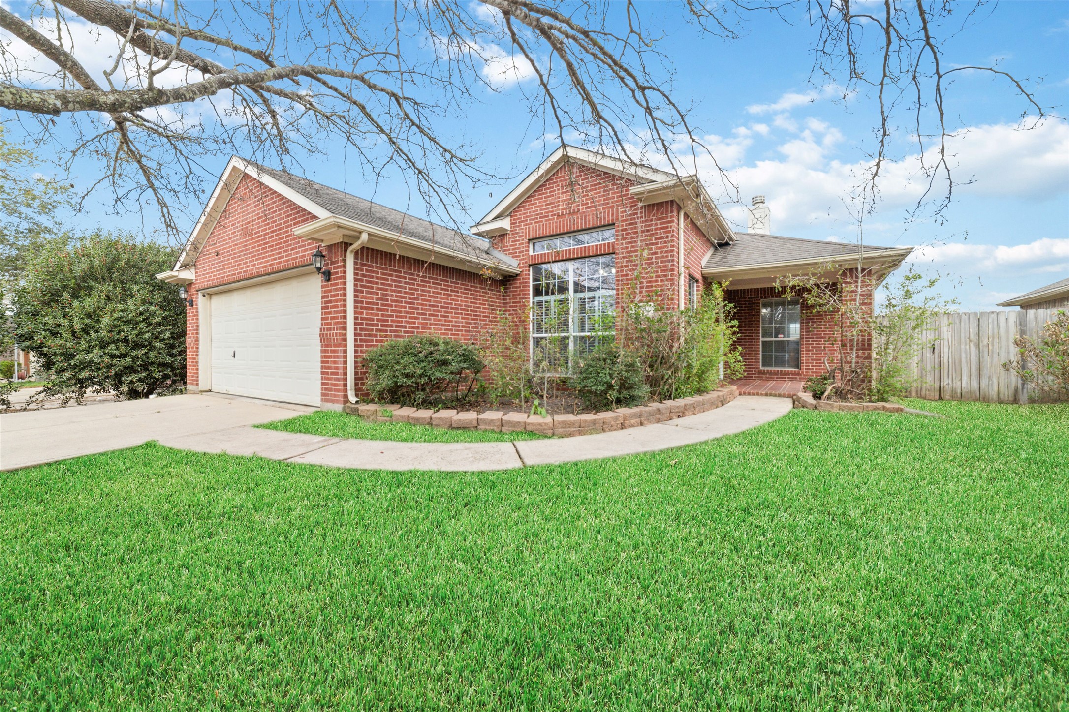22911 Sebastian Drive Porter, TX 77365 - Photo 2 of 23 a view of a house with a yard and potted plants