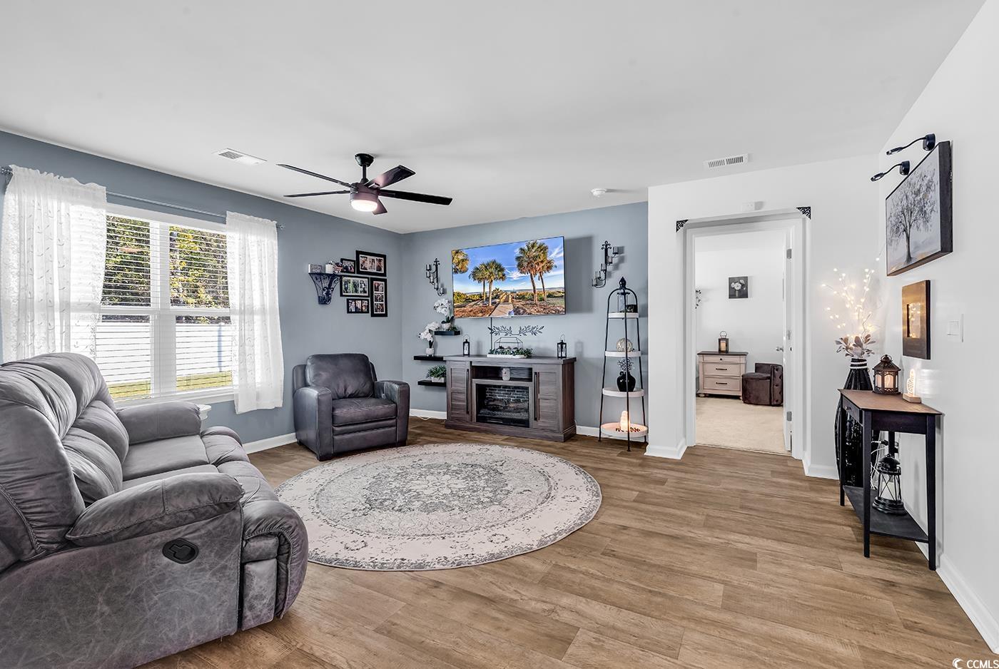 164 Seasons Trace Loop Longs, SC 29568 - Photo 16 of 40 Living room featuring light wood finished floors and ceiling fan