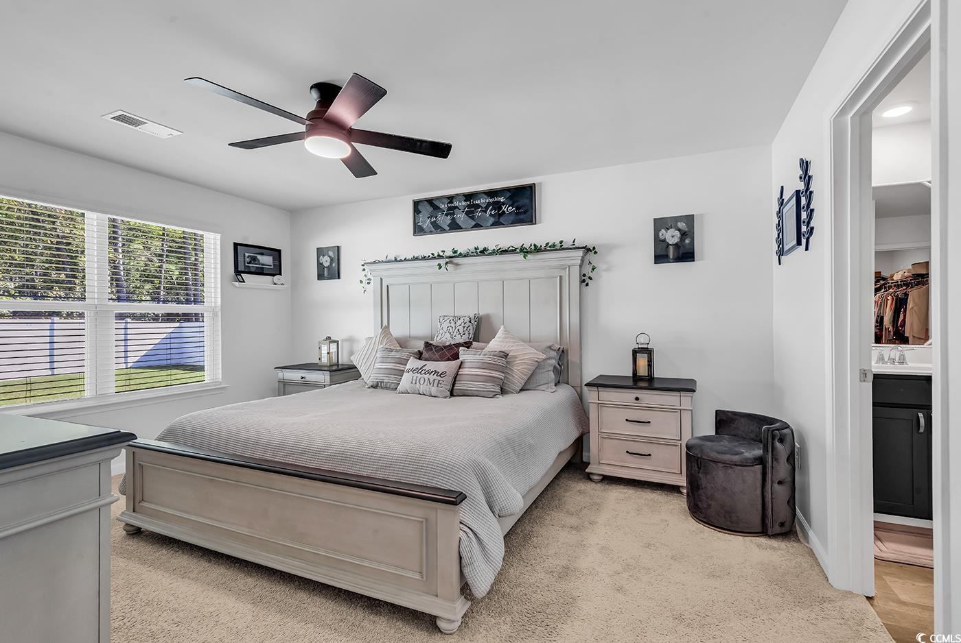 164 Seasons Trace Loop Longs, SC 29568 - Photo 18 of 40 Bedroom with light carpet and ceiling fan