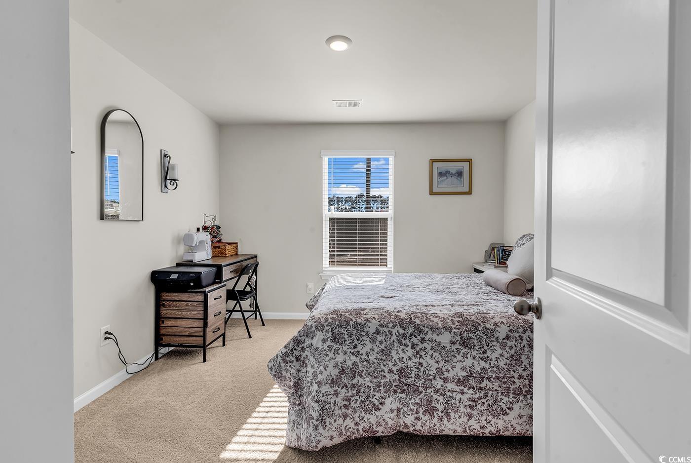 164 Seasons Trace Loop Longs, SC 29568 - Photo 28 of 40 Bedroom with light colored carpet and baseboards