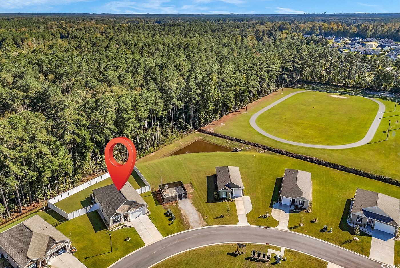 164 Seasons Trace Loop Longs, SC 29568 - Photo 37 of 40 Aerial view of residential area with a forest