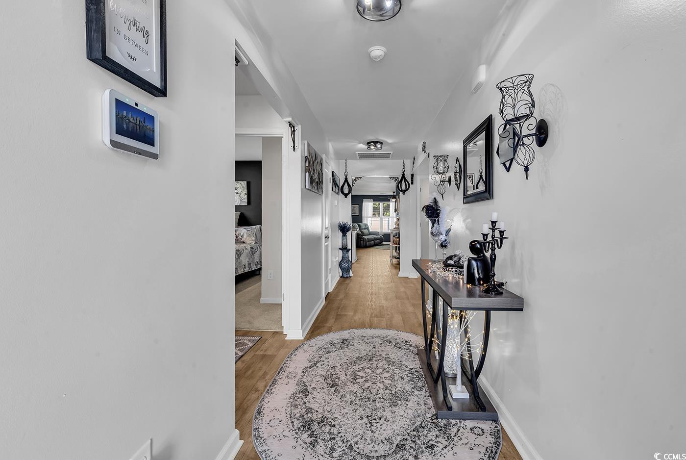 164 Seasons Trace Loop Longs, SC 29568 - Photo 5 of 40 Hallway featuring light wood finished floors and baseboards