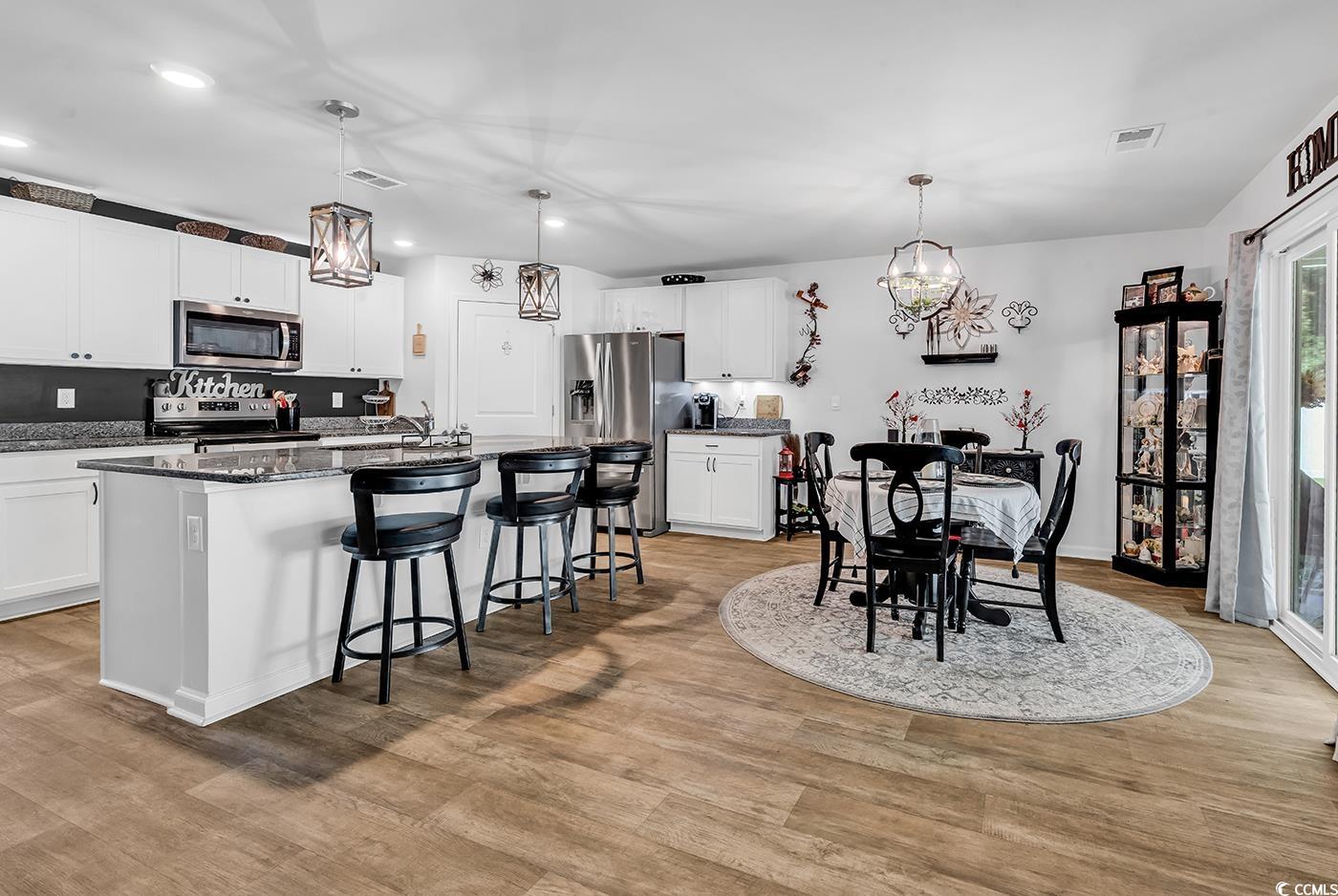 164 Seasons Trace Loop Longs, SC 29568 - Photo 9 of 40 Dining area with light wood-type flooring, a chandelier, and recessed lighting