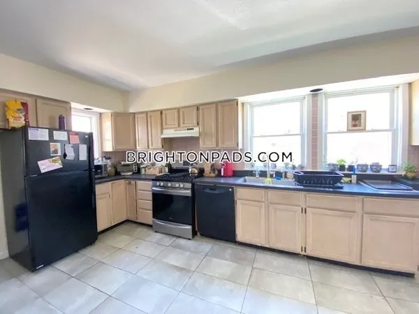 a kitchen with granite countertop a sink and cabinets