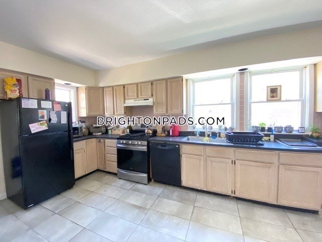 a kitchen with granite countertop a sink and cabinets