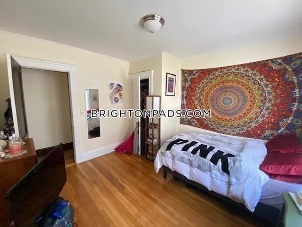 a bedroom with bed and a window