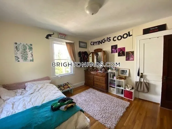 a bed room with a bed and a window