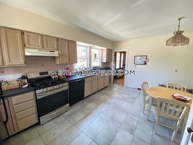 75 Claymoss Road, Unit 1 Boston, MA 02135 - Photo 2 of 25 a kitchen with stainless steel appliances granite countertop a stove sink and cabinets