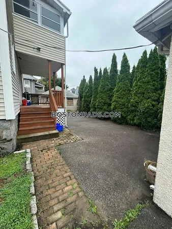 a view of a porch with hardwood