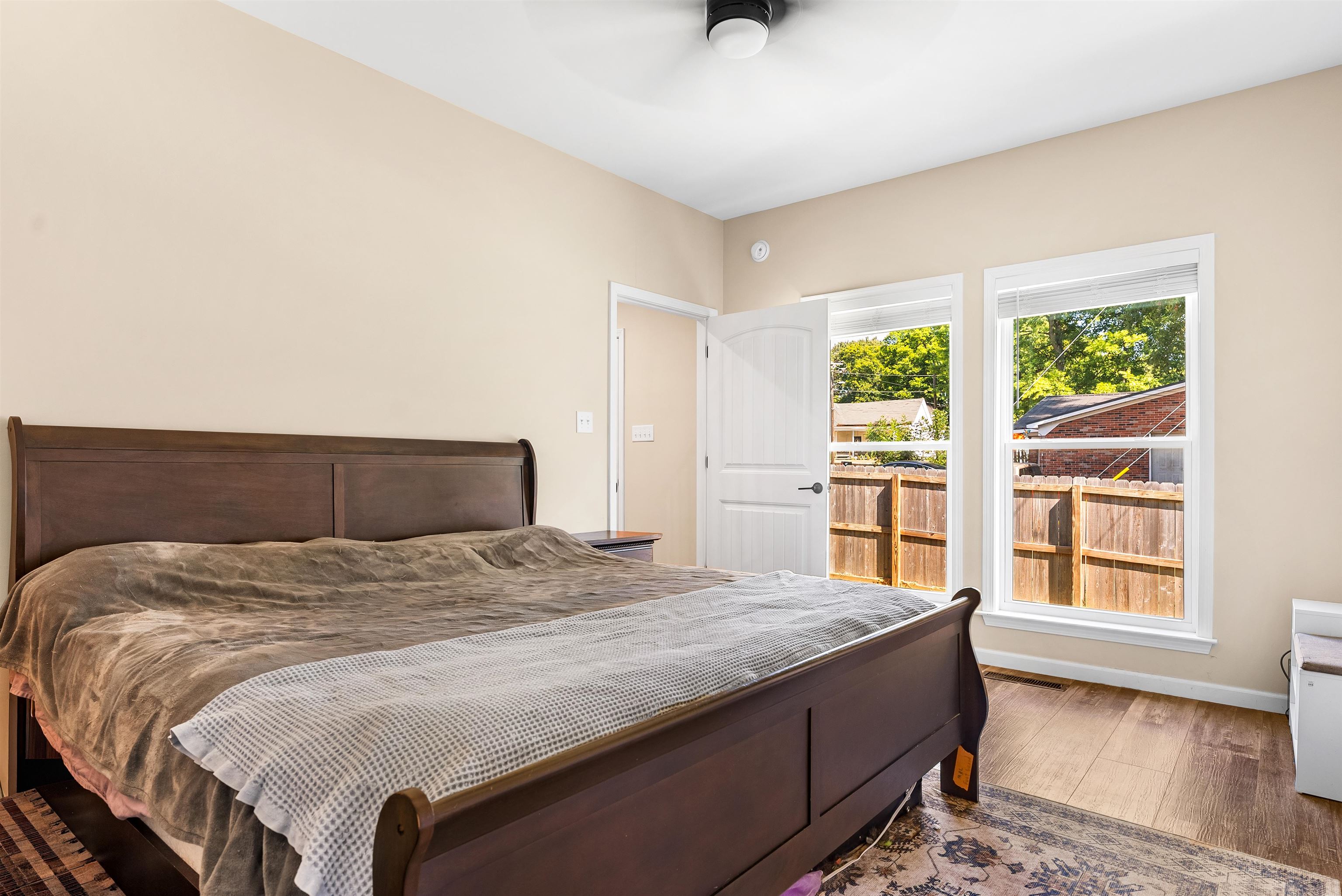 212 South Tipton Street Covington, TN 38019 - Photo 11 of 27 a bed sitting in a spacious bedroom next to a window