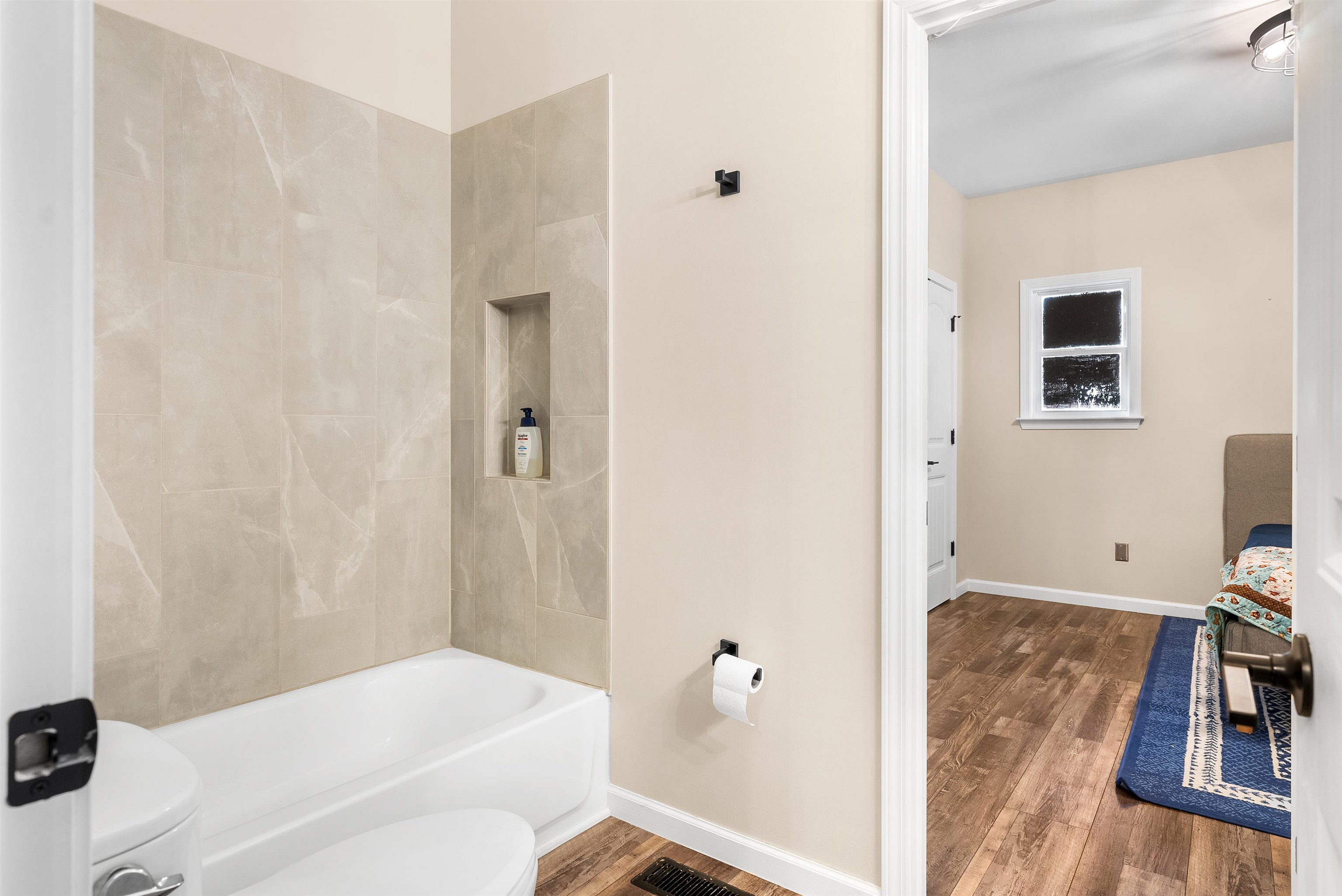 212 South Tipton Street Covington, TN 38019 - Photo 14 of 27 a bathroom with a bathtub sink and toilet