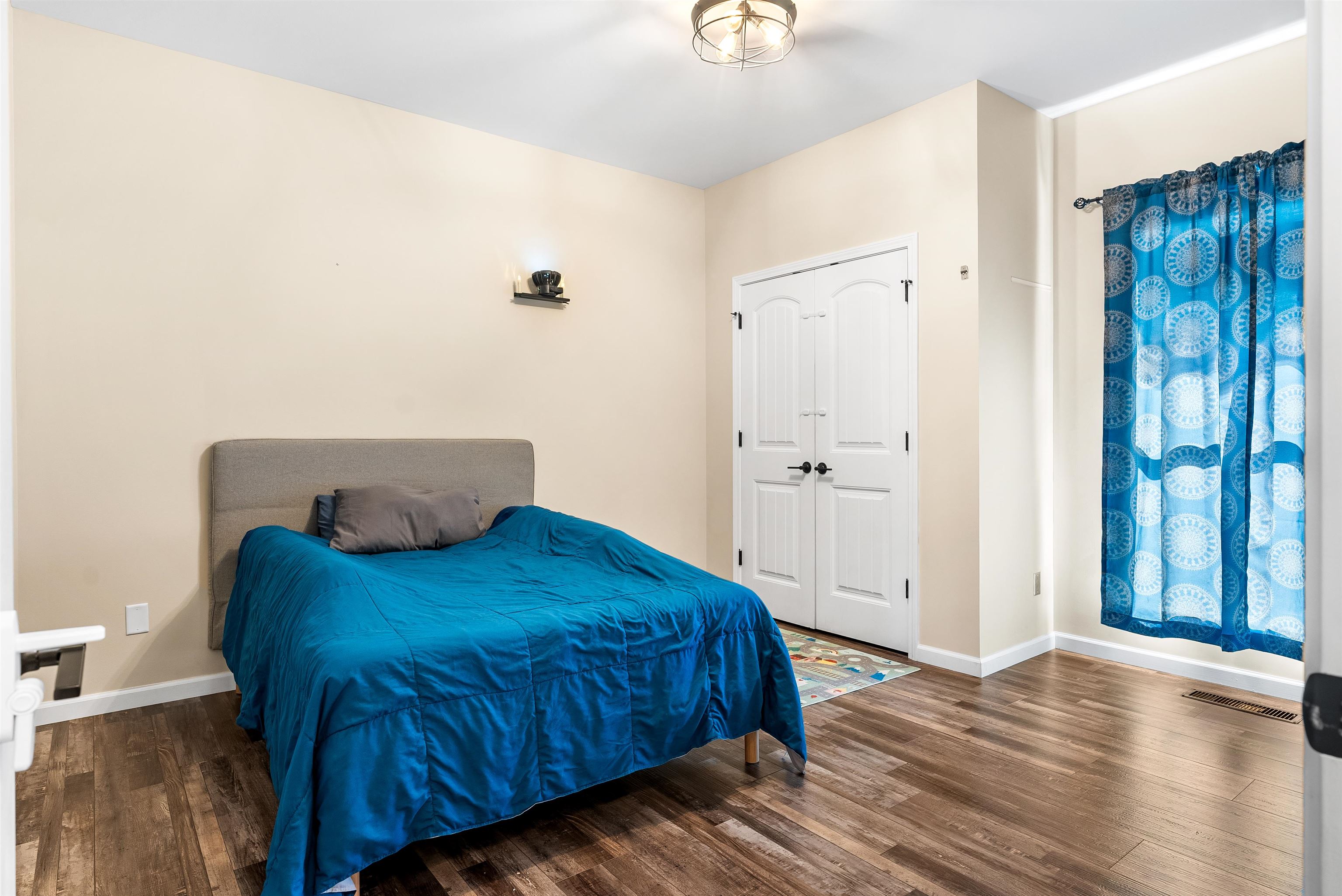 212 South Tipton Street Covington, TN 38019 - Photo 15 of 27 a bedroom with a bed and a window