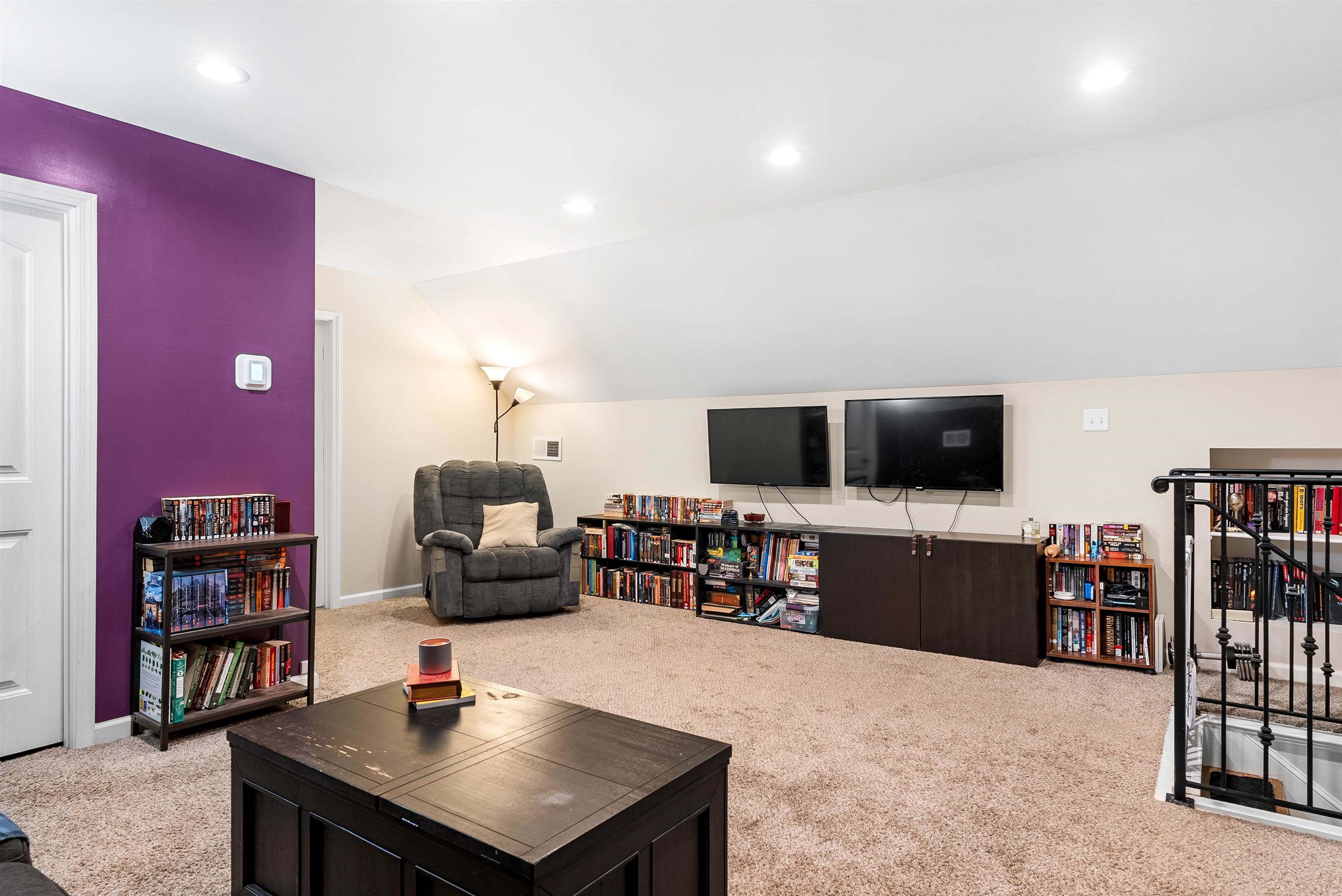 212 South Tipton Street Covington, TN 38019 - Photo 18 of 27 a living room with furniture and a flat screen tv