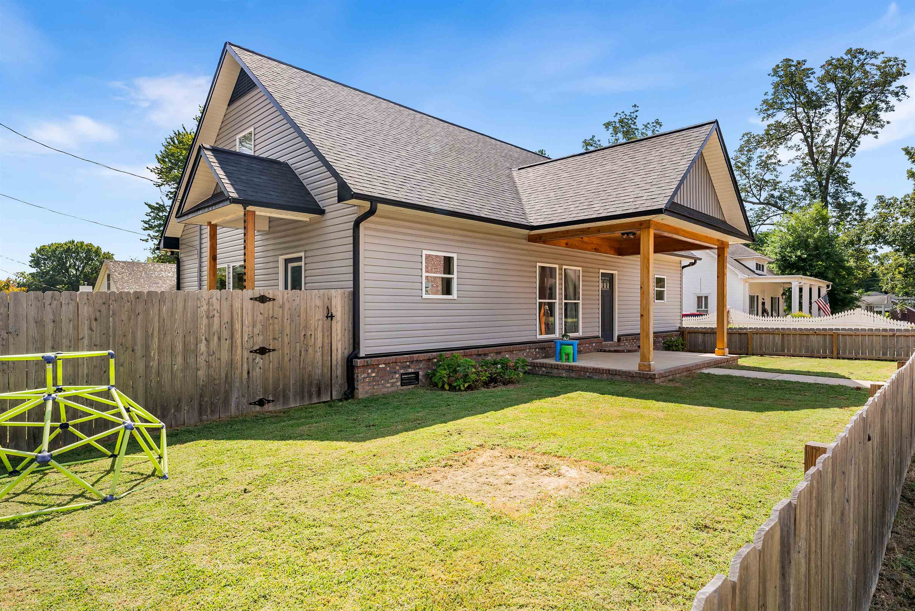 212 South Tipton Street Covington, TN 38019 - Photo 2 of 27 a view of an house with backyard space and swimming pool